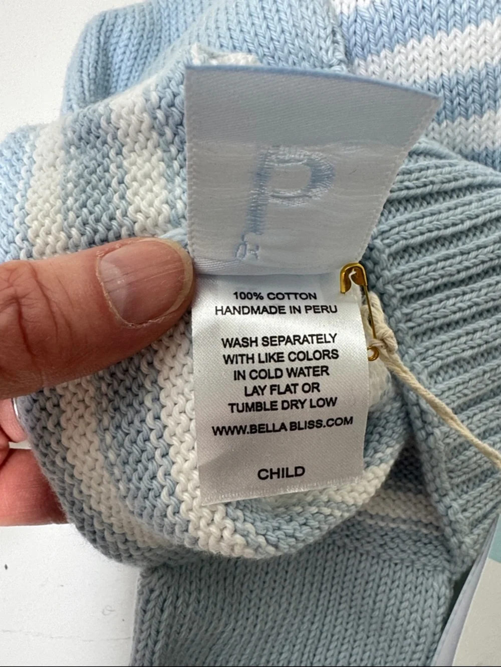 NWT Bella Bliss blue and white cotton child’s hat with ear flaps and ties.